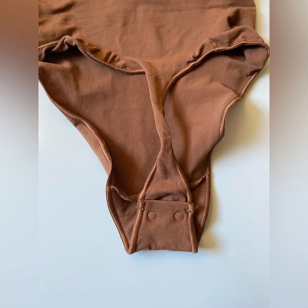Skims Seamless Sculpting Thong Bodysuit in Bronze